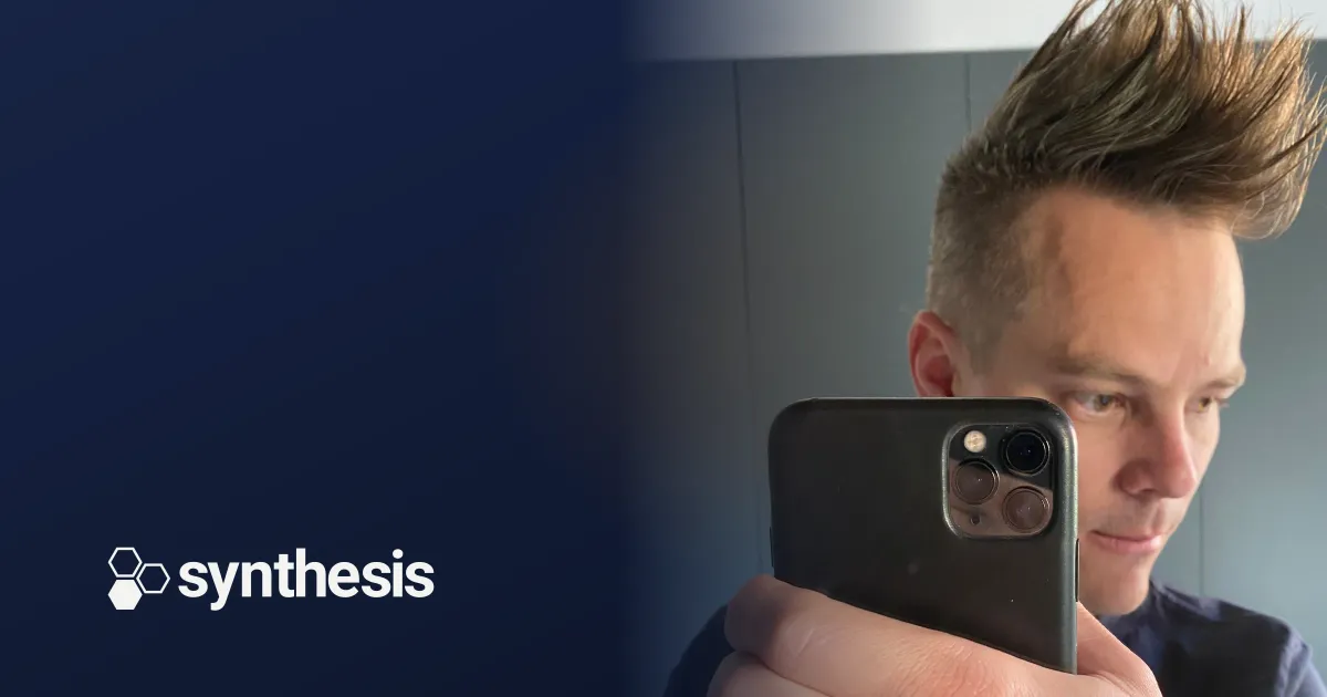 Tom Wells with the Synthesis logo